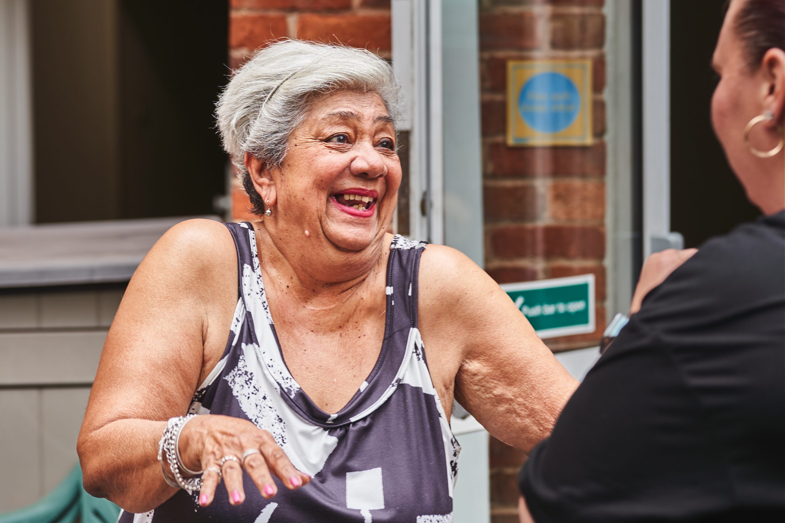Two women smiling and talking